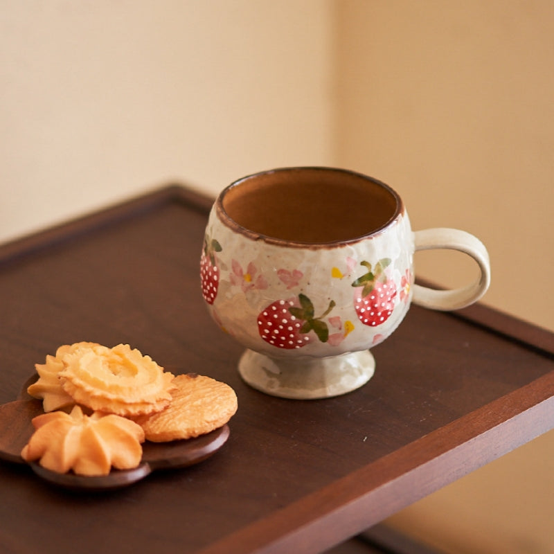Two Ceravor strawberry footed ceramic mugs displayed together