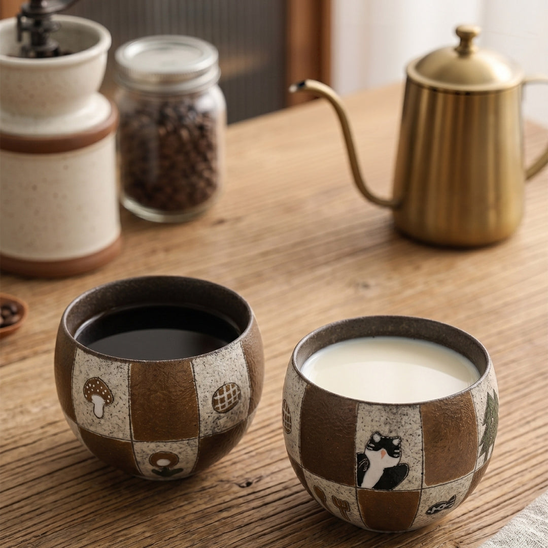 Pouring milk into Ceravor patchwork cat ceramic cup to make latte art