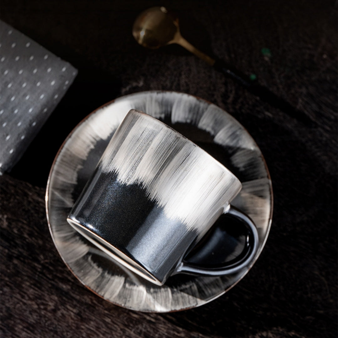 Person holding Ceravor white ceramic cup showing translucent window tracery pattern