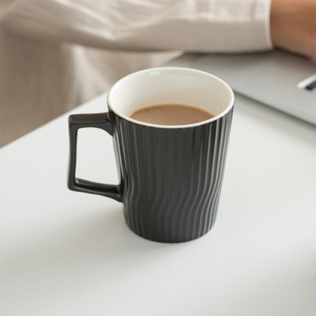 Person holding Ceravor white ribbed ceramic coffee mug