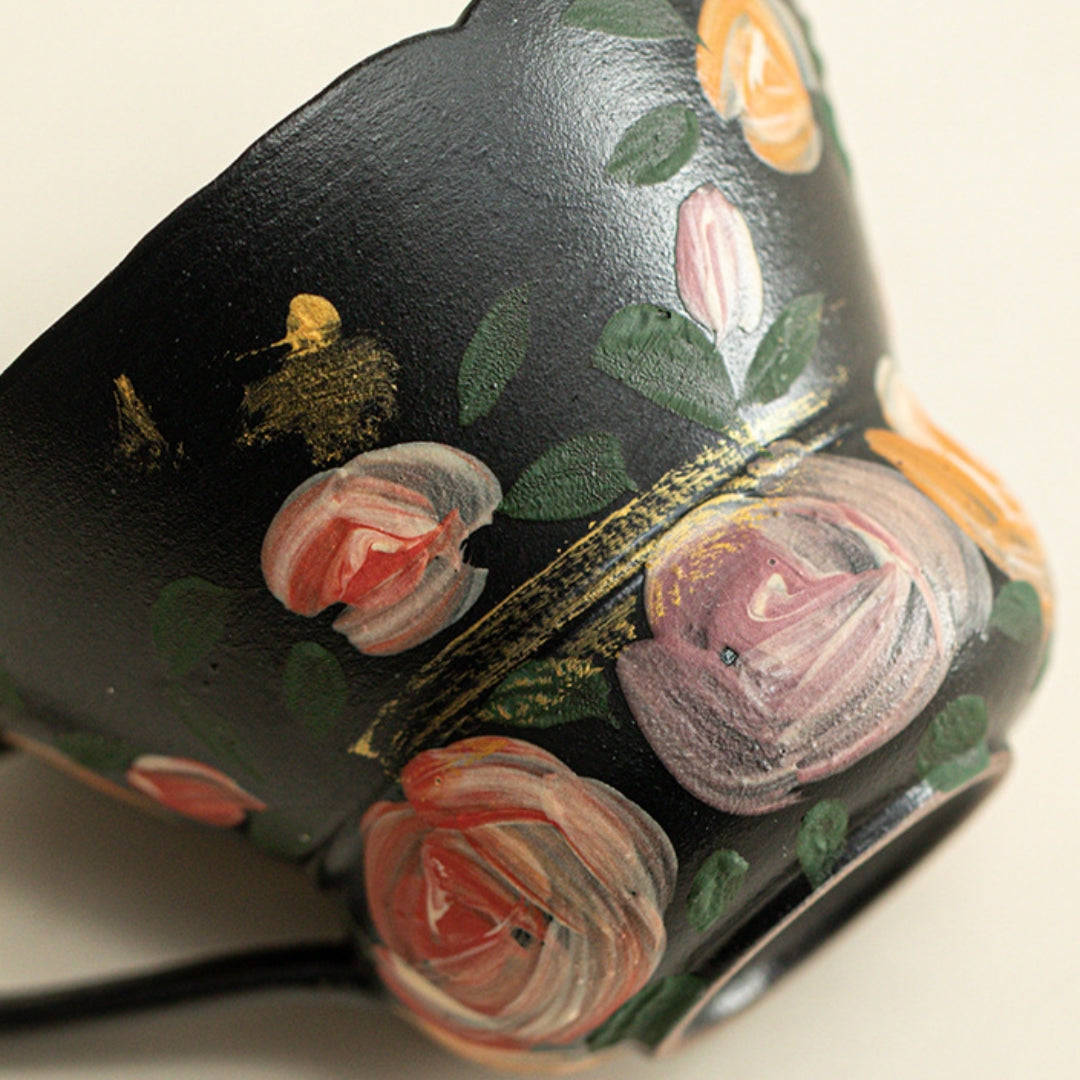 Ceravor black rose espresso cup filled with dark coffee on wooden table