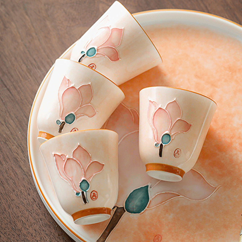 Four Ceravor floral aroma teacups arranged on a matching ceramic tray