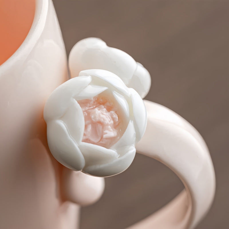 Close-up of the sculptural white ceramic flower handle on Ceravor pink mug