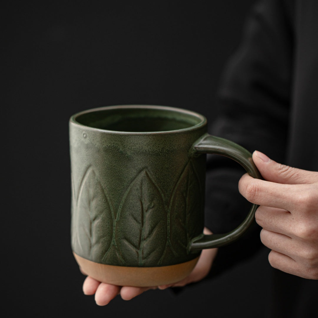 Close-up of the embossed small leaves and handle on the Ceravor green mug