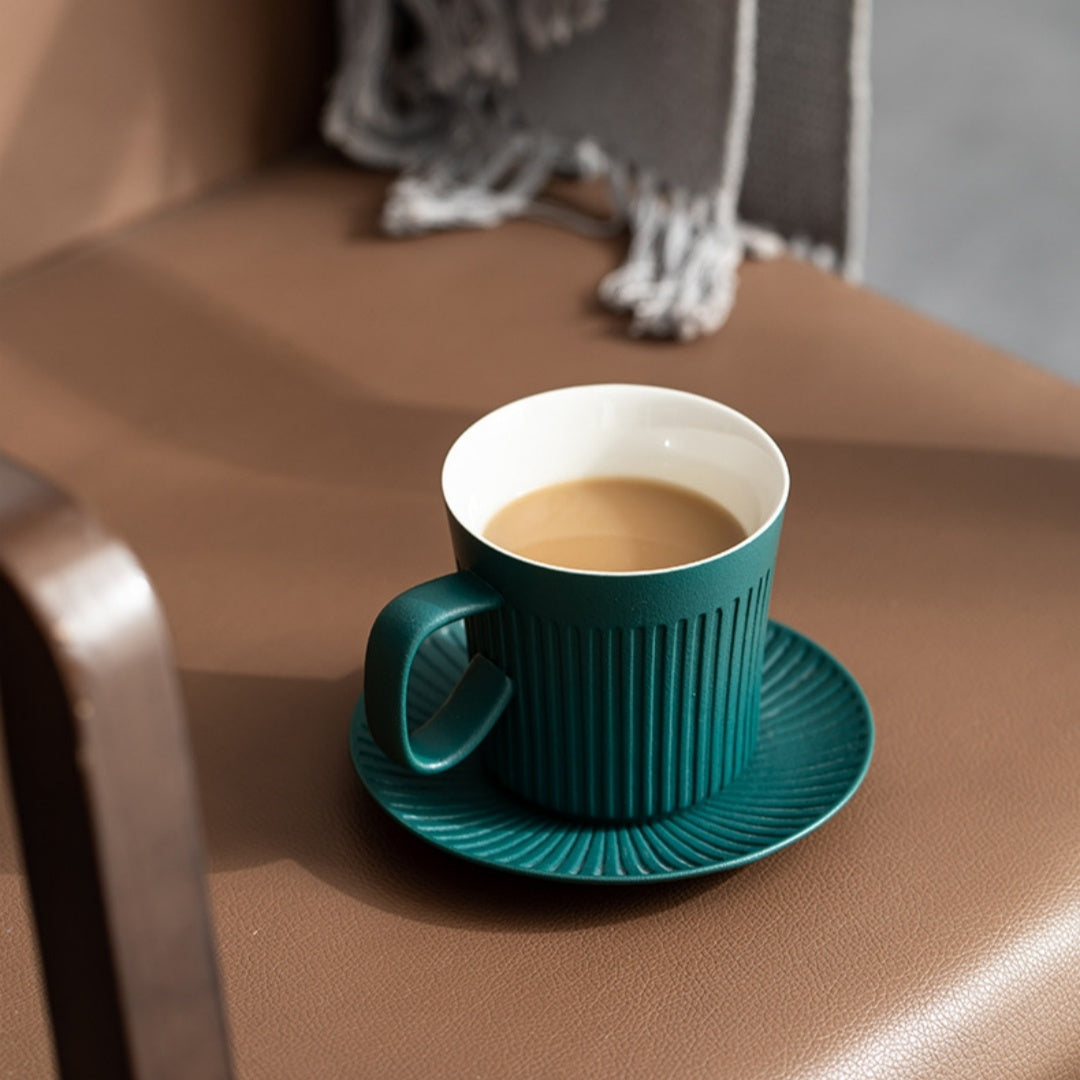 Person holding Ceravor green ribbed ceramic coffee mug with wooden handle