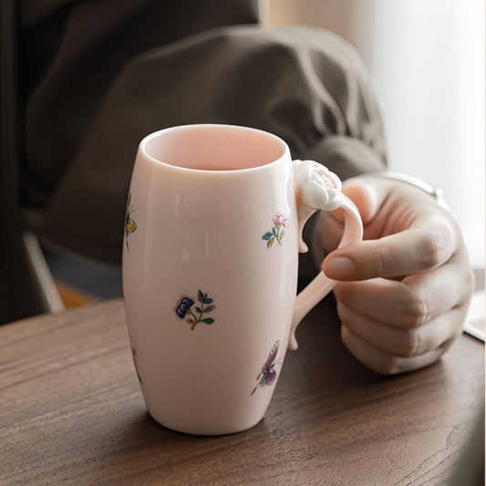 Ceravor Peony Garden pink ceramic mug with tea next to a white plate