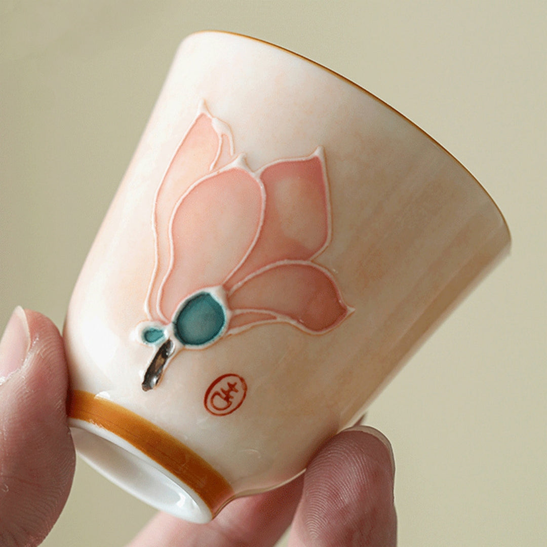 Close-up detail of the ceramic glaze and floral texture on the Ceravor cup