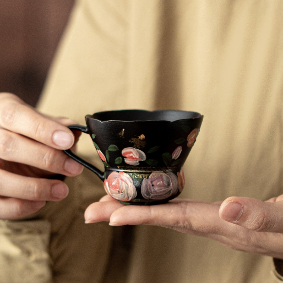 Bottom of Ceravor black espresso cup showing the gold character Dream (梦)