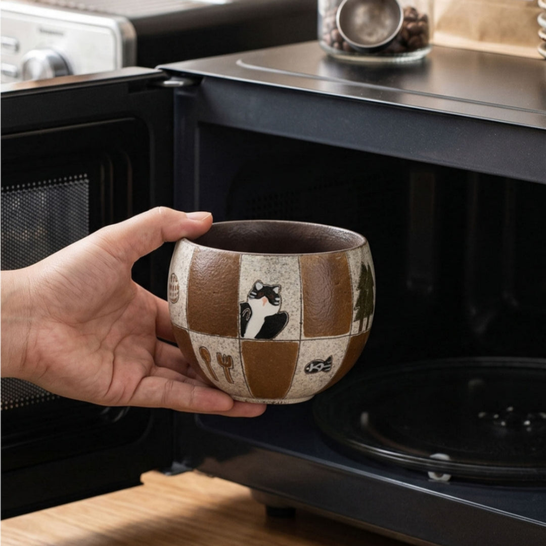 Pouring drip coffee into Ceravor patchwork cat cup