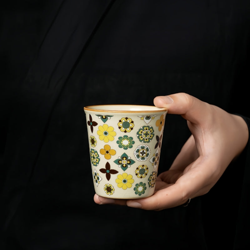Ceravor retro floral ceramic cup being held by a hand