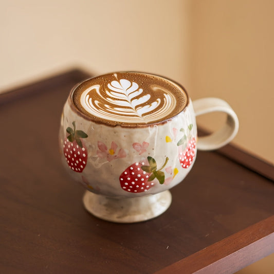 Ceravor hand-painted strawberry ceramic mug with latte art on wooden table